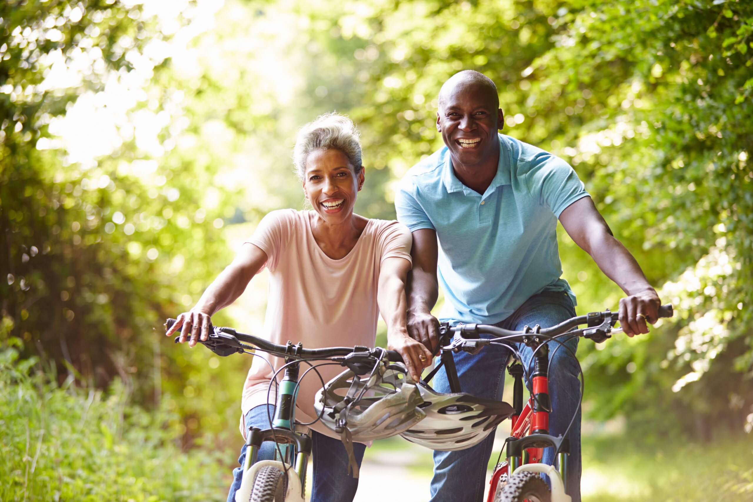 Mature,African,American,Couple,On,Cycle,Ride,In,Countryside